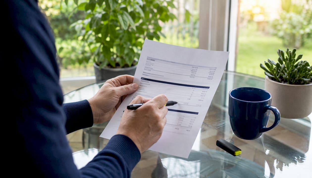 Close-up of hands reviewing mortgage statement