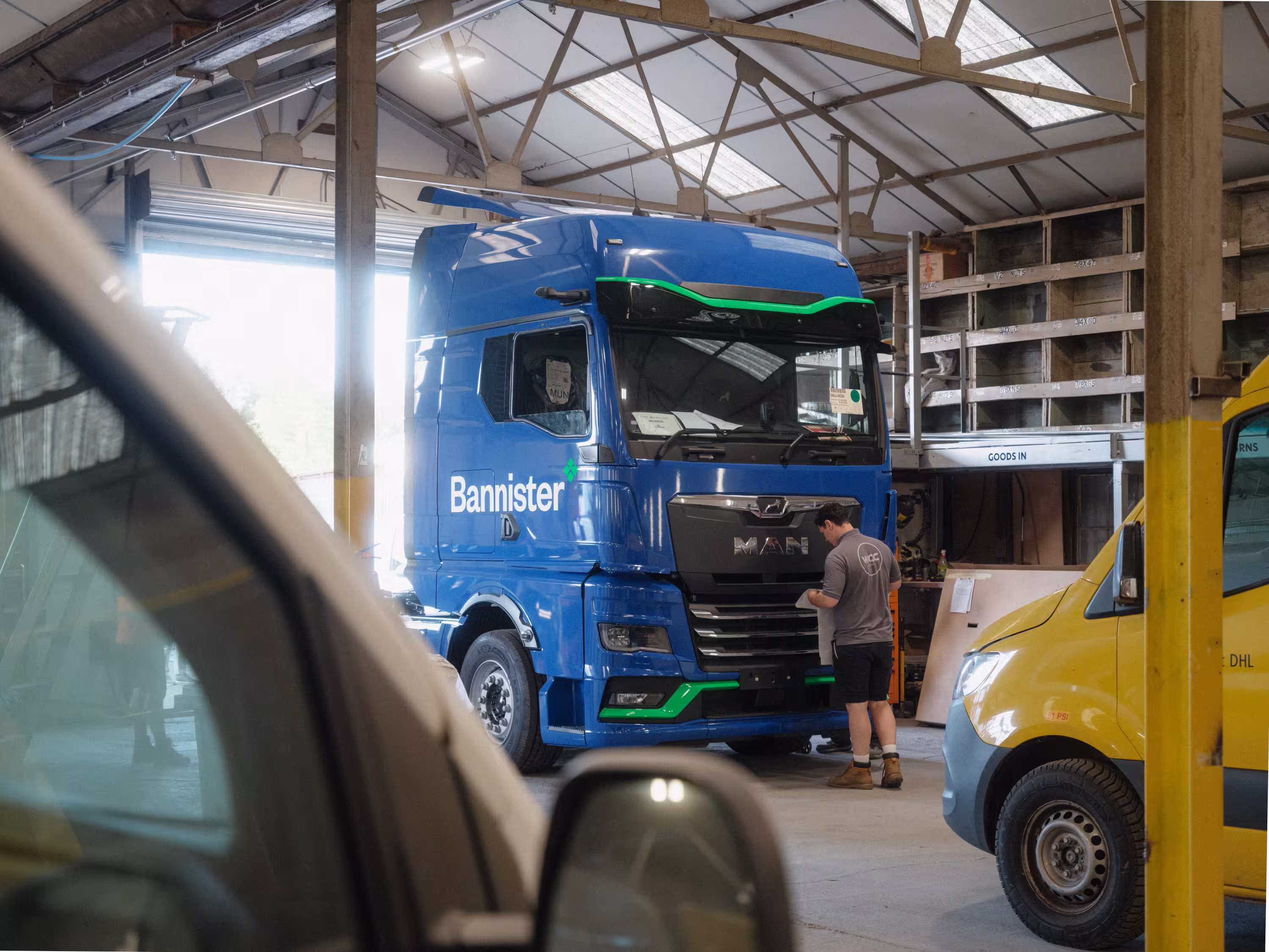 MAN eTGX truck with Bannister branded wrap by WCC in the Workshop.