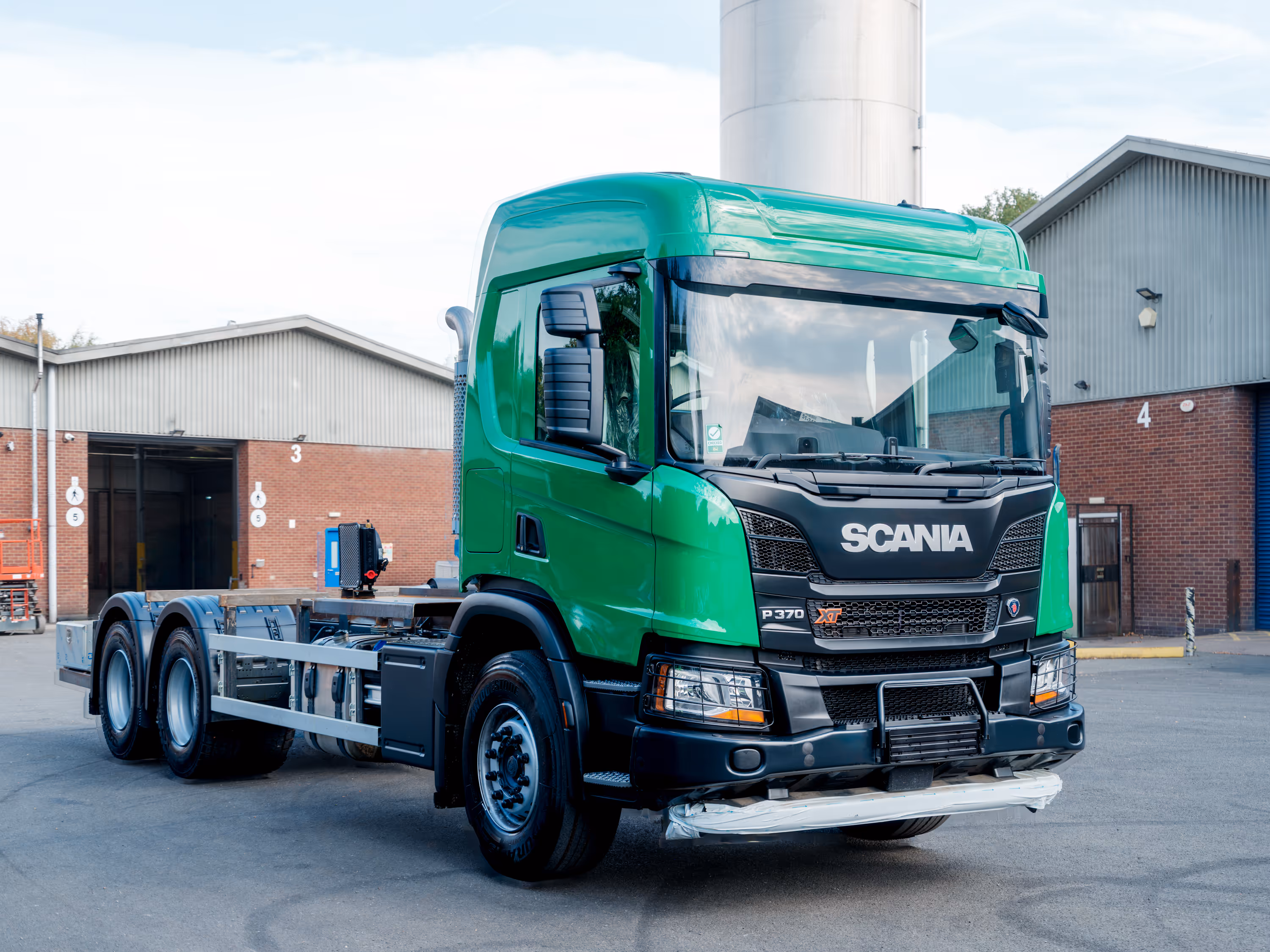 Freshly painted green Scania P370 XT truck by WCC.
