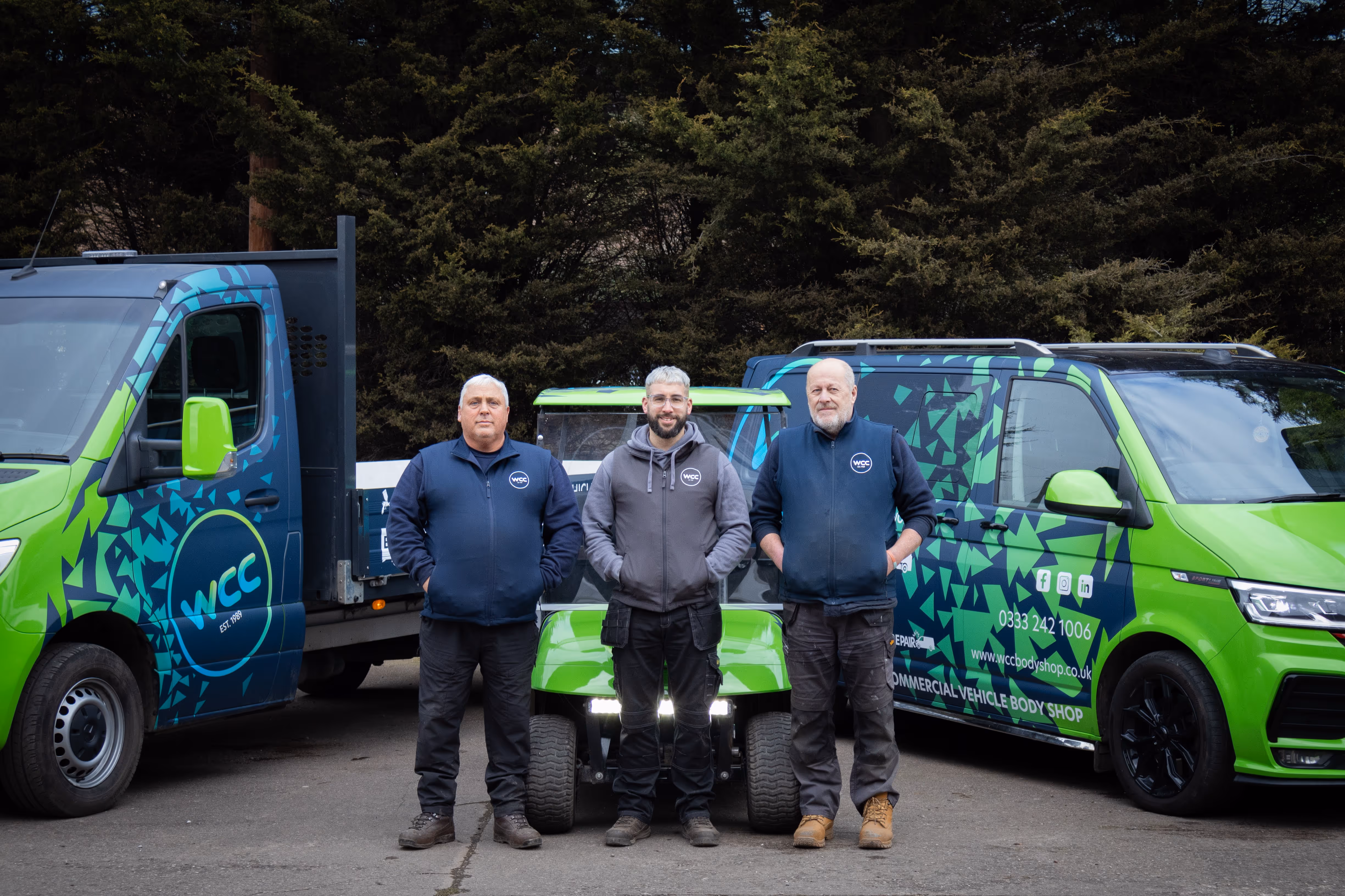 WCC Logistics team standing in front of their fleet.