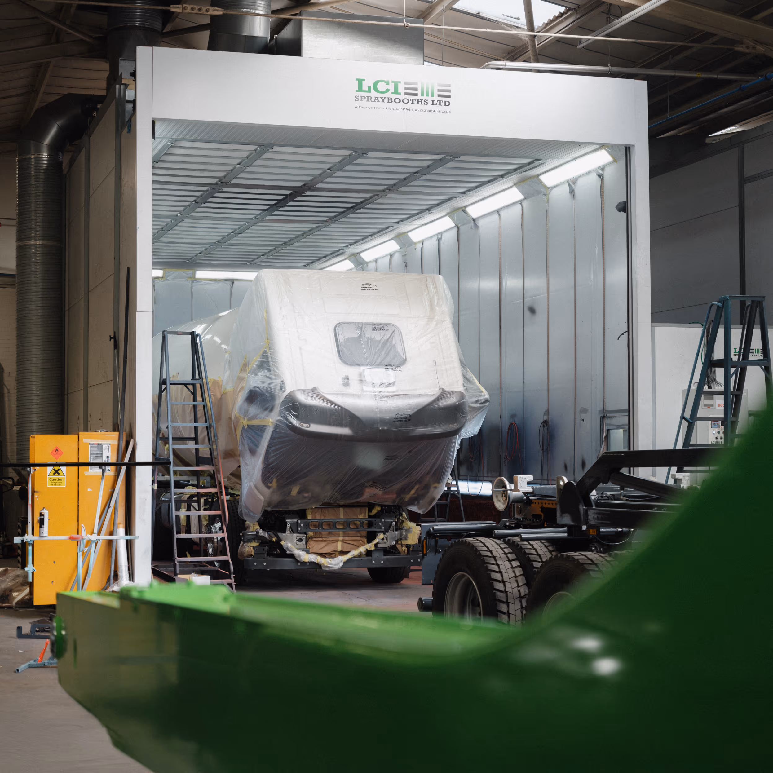 Commercial truck being prepped inside an LCI spray booth at WCC.
