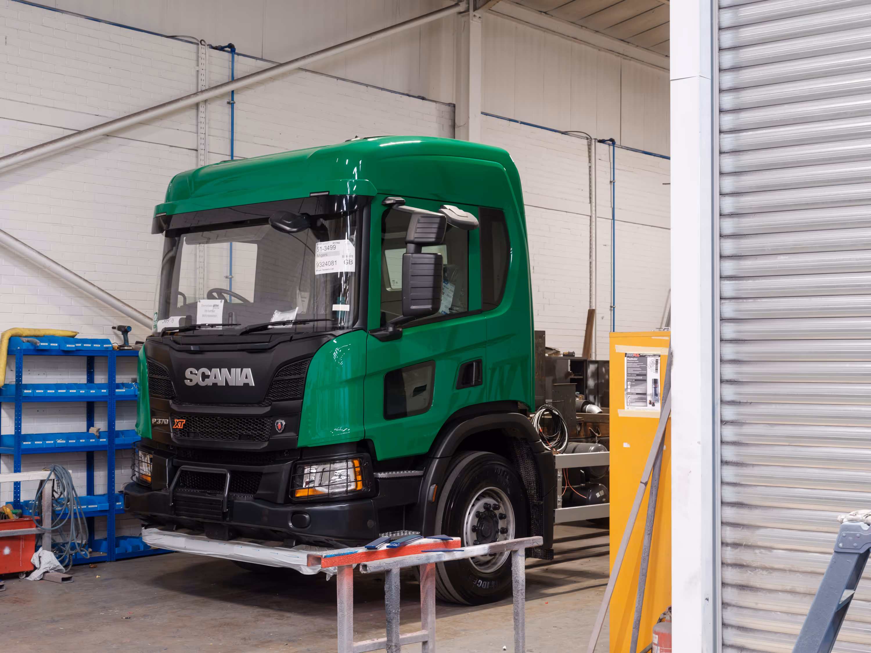 A freshly painted green Scania. 