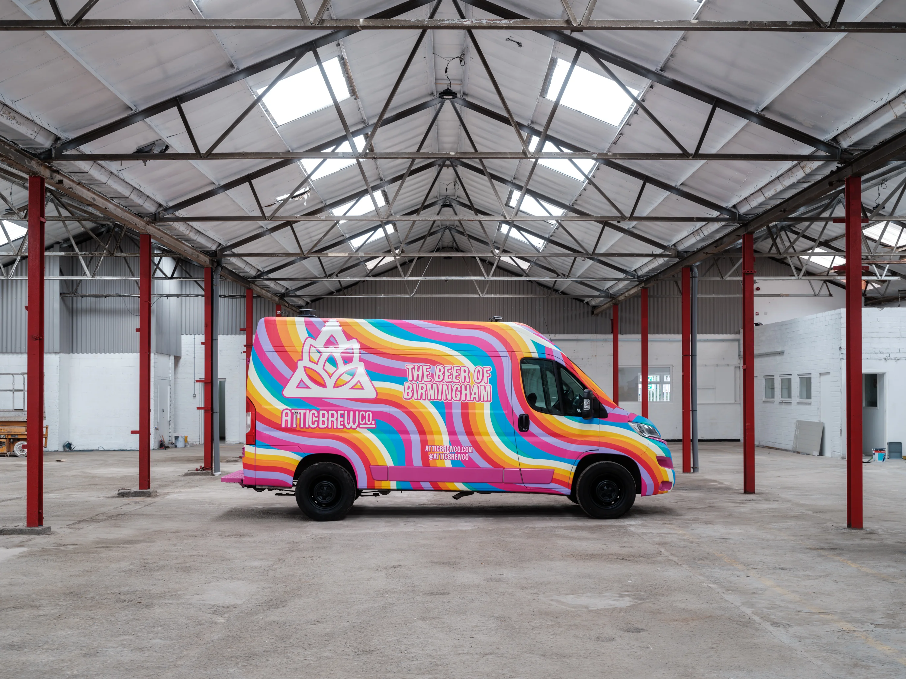 A side profile of the Attic Brew van, wrapped by WCC.