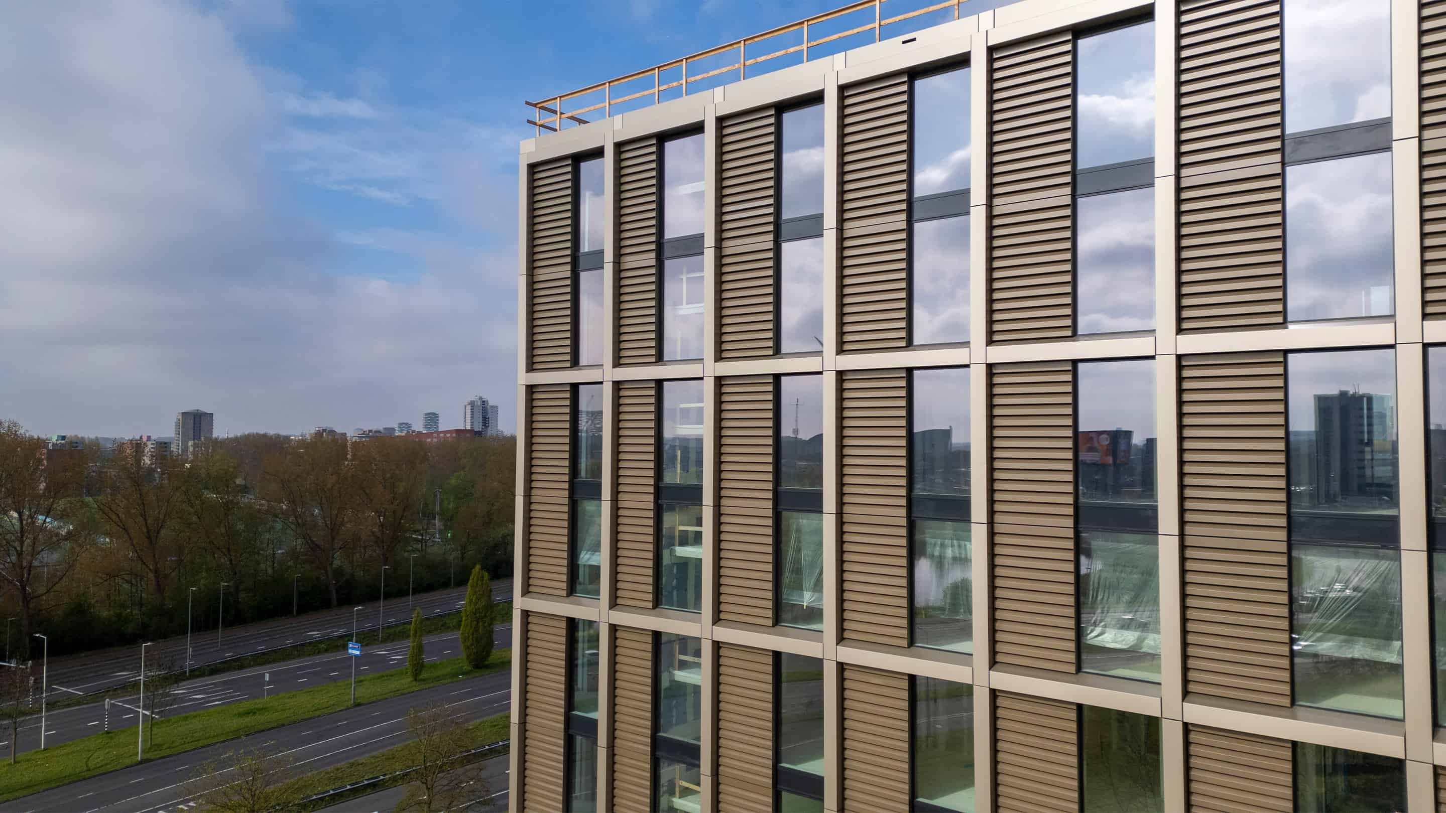 Side view of the facade grilles on the Canvas Living building in Rotterdam Brainpark next to the highway.