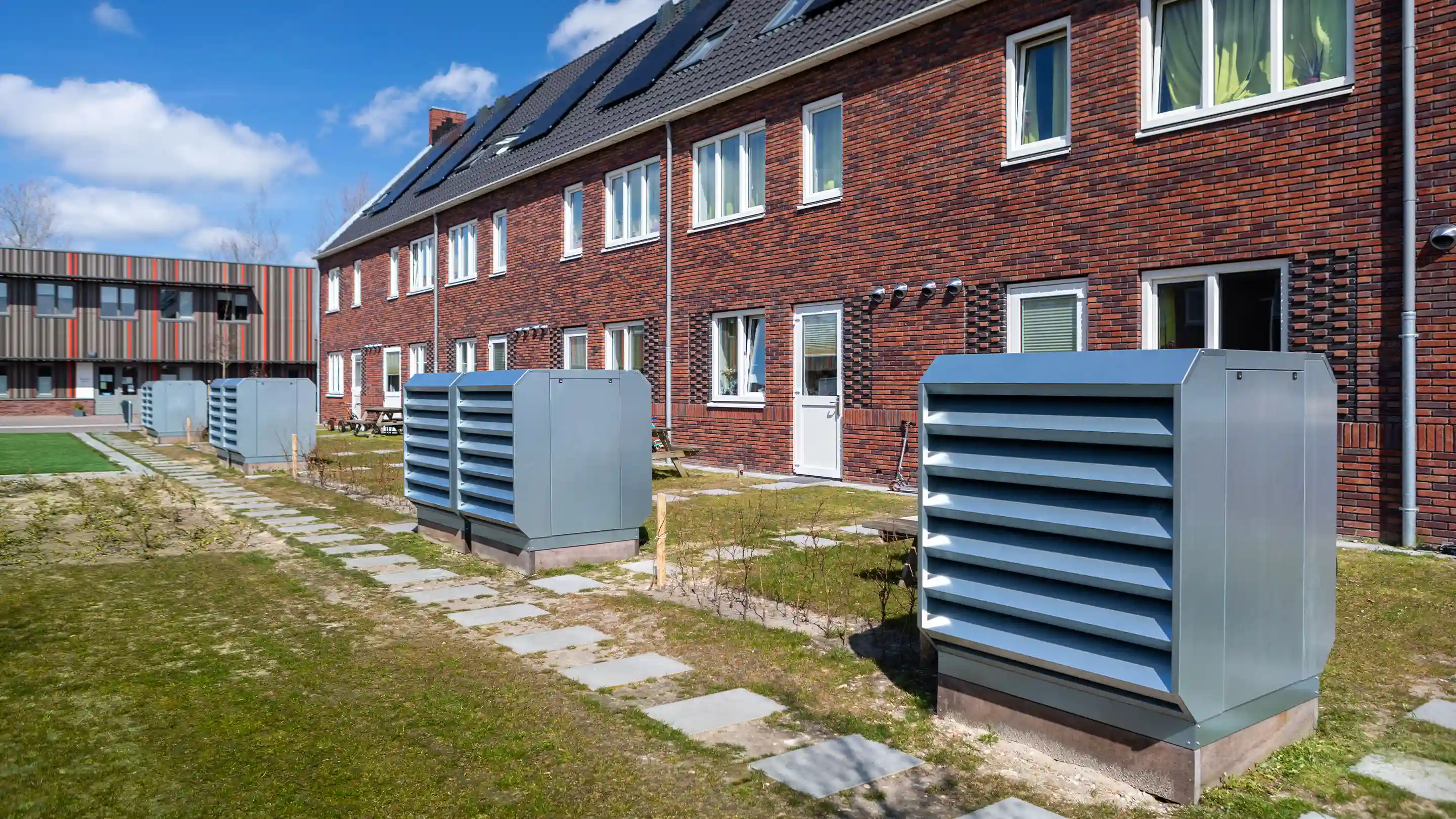 DICE noise control enclosures in front of the houses of AZC Burgurm.