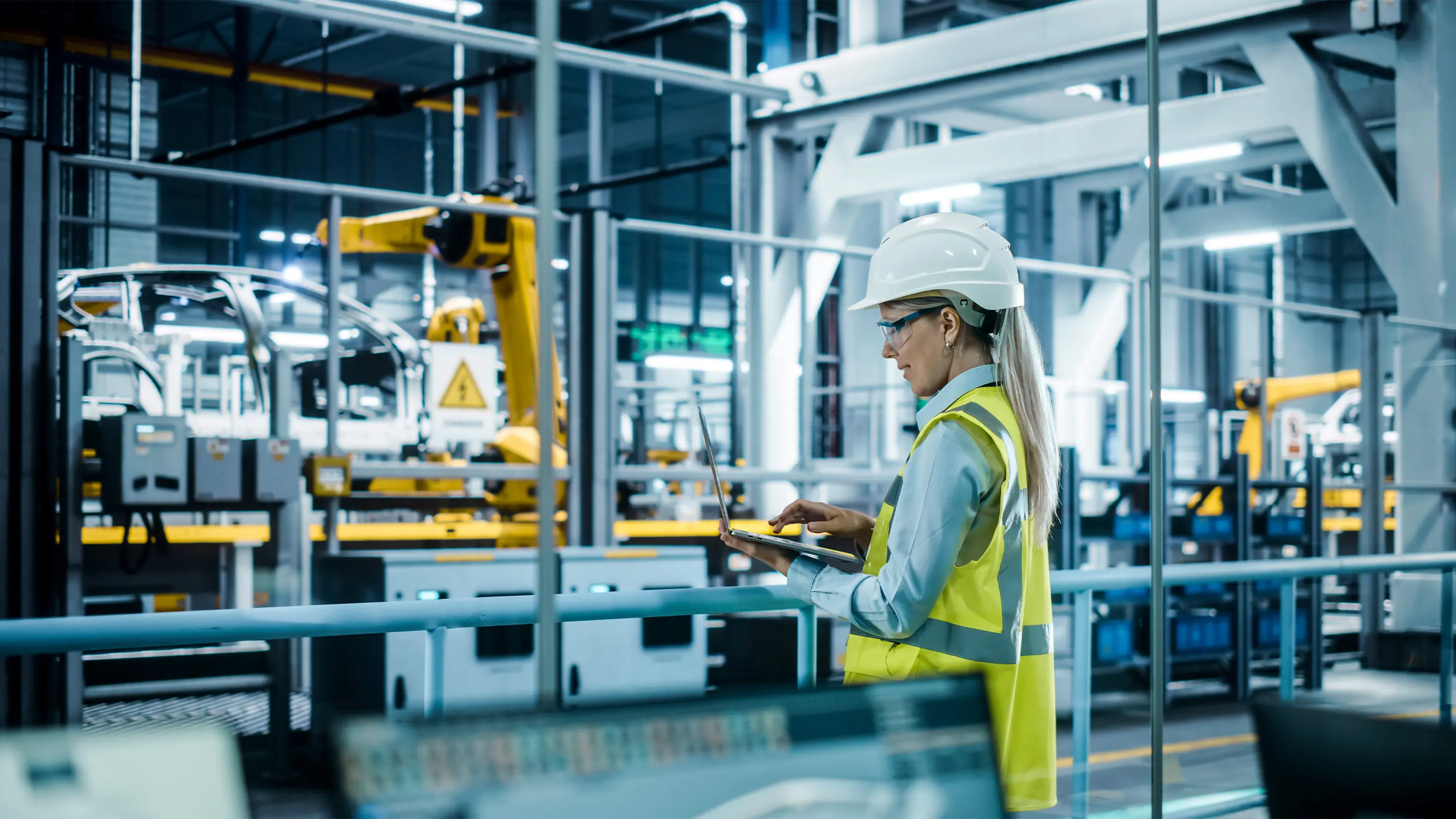 Engineer in a production facility working on safety and acoustic performance solutions for the manufacturing industry.