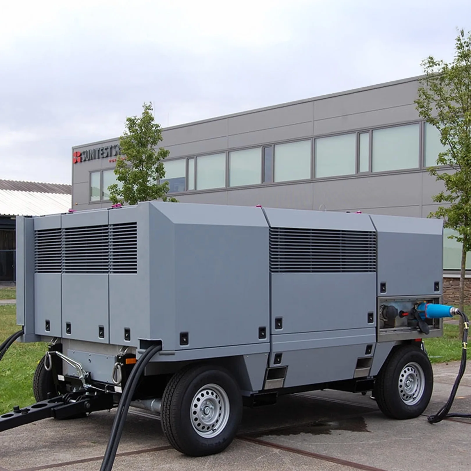 Sun Test Systems in front of building.