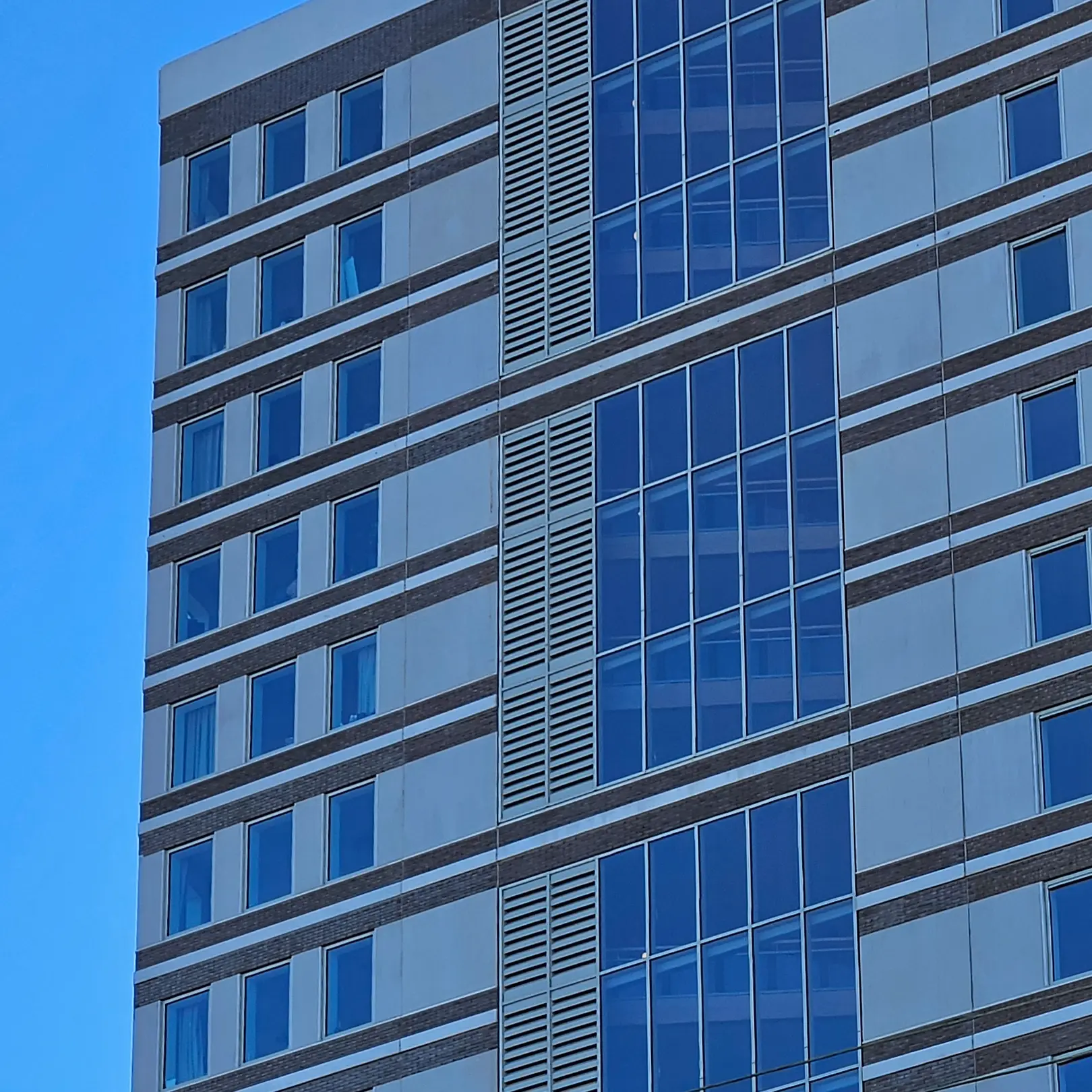 AKR 300 acoustic louvre in high building to reduce noise from outside.