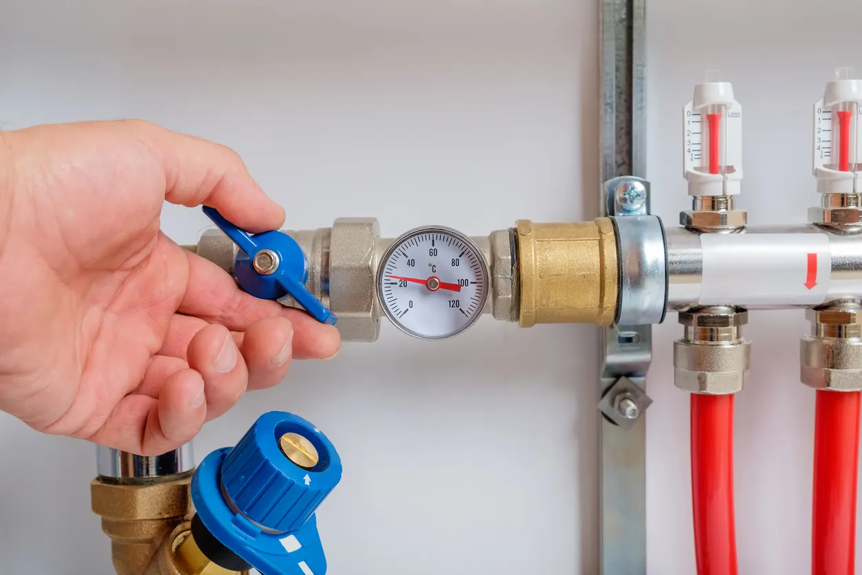 A close shot of person installing and checking a gas line