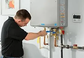 Man installing a tankless water heater.