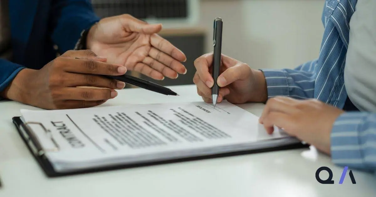 Two professionals reviewing and signing a business case document, representing CFO approval and finance scrutiny in enterprise sales.