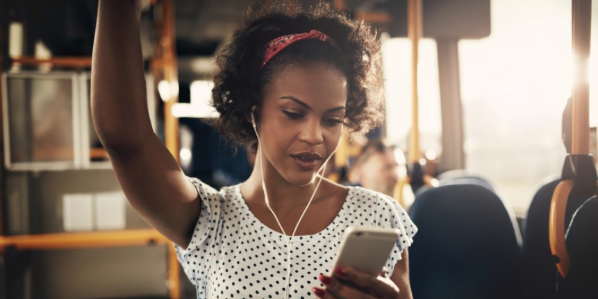person on a bus reading from their phone