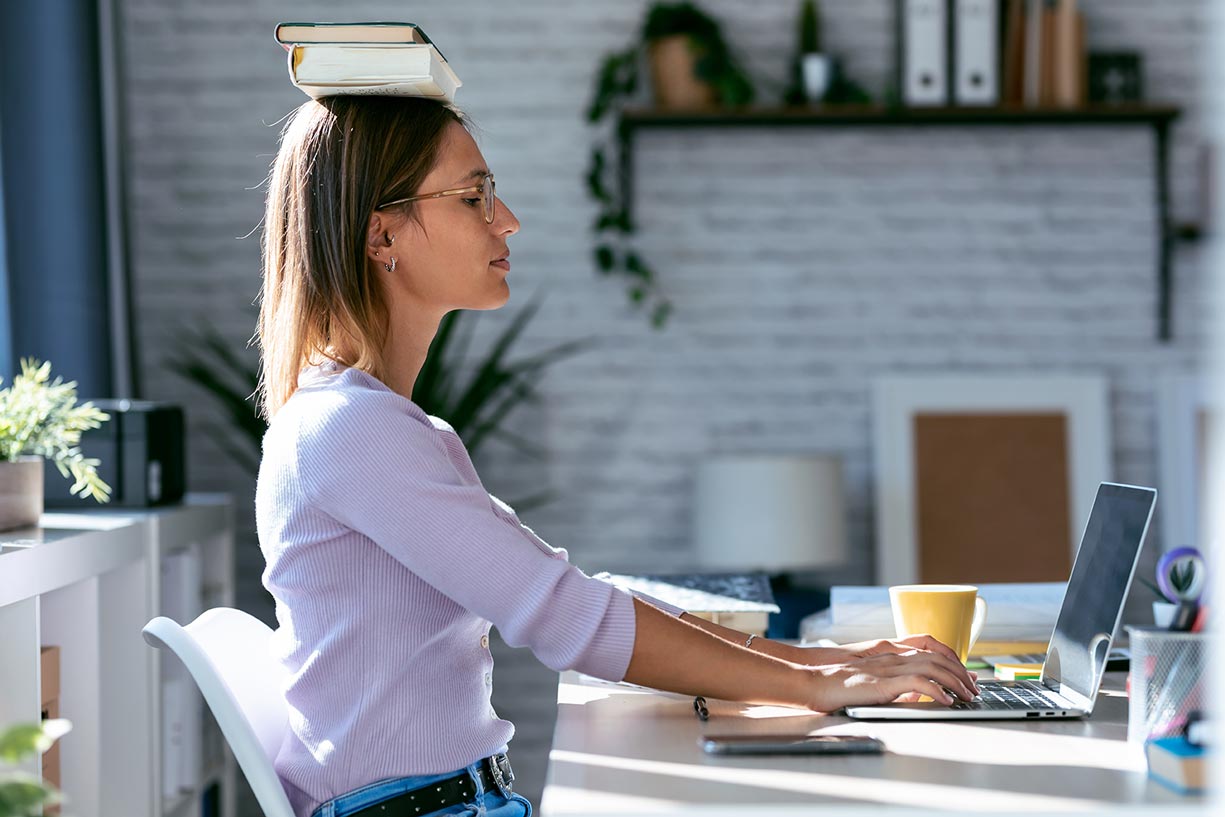 A woman practicing good posture.