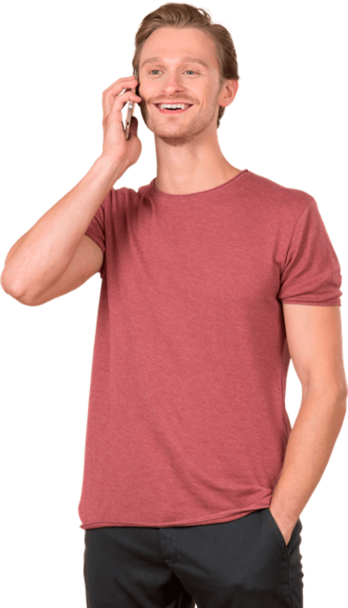 friendly man smiling whilst on a mobile phone