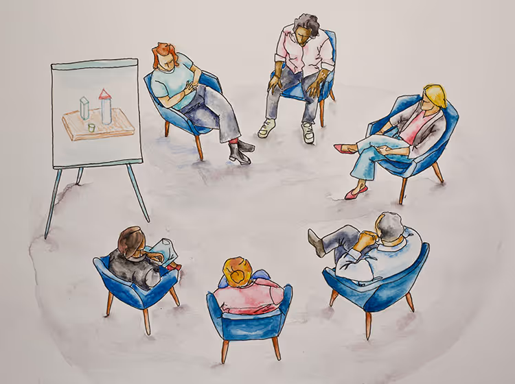 Illustration einer Gruppensitzung mit sechs Personen, die in einem Kreis auf blauen Sesseln sitzen, neben einem Flipchart.