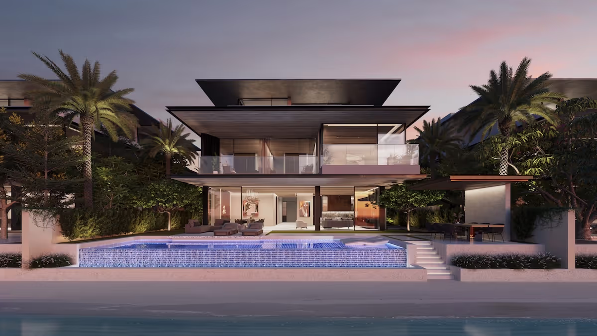 A beachfront villa with a swimming pool and surrounded by palm trees at palm jebel ali, Dubai.