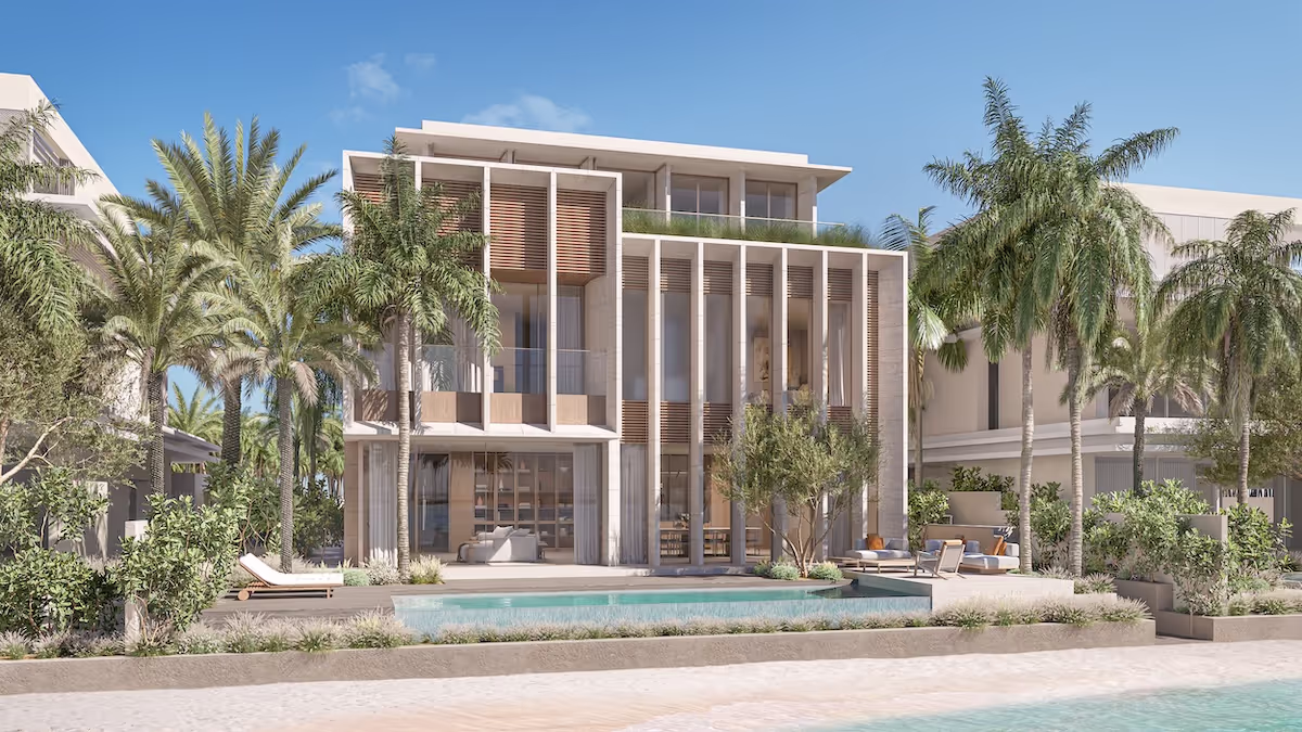 A luxury villa with a swimming pool overlooking the beach at Palm Jebel Ali.