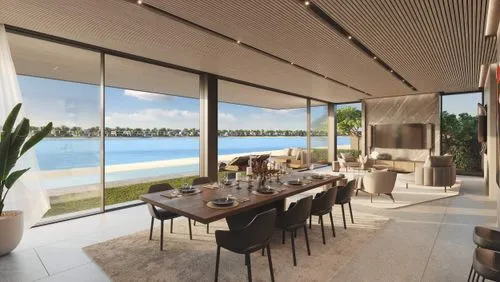 A luxurious living space featuring a designer table and chairs, bathed in warm light from a chandelier, with a breathtaking vista of a lake.