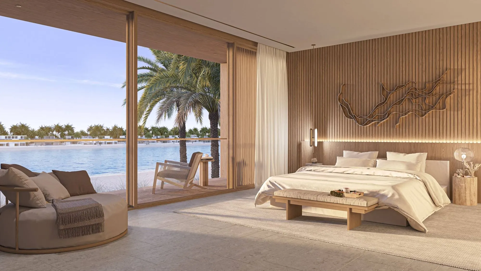 Master bedroom with a balcony and an ocean panorama in the luxury living of Coral Collection Villas.