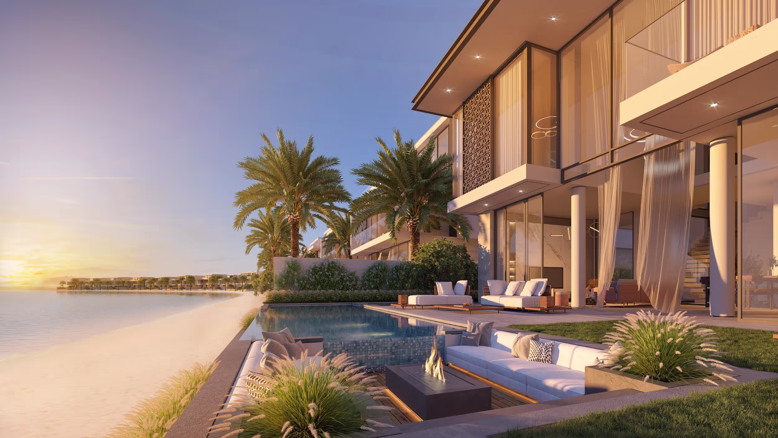 A spacious villa with floor-to-ceiling windows and a large outdoor entertaining area.