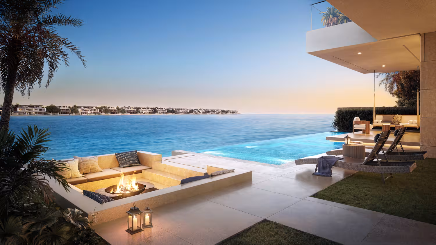A scenic beach view during sunset featuring palm trees, with a hotel and infinity pool in the foreground.