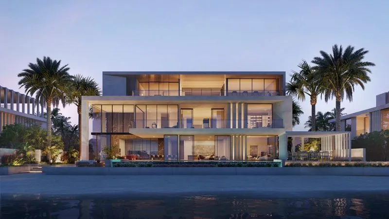 Luxury villa showcasing a private pool, palm trees, and a stunning beachfront location.