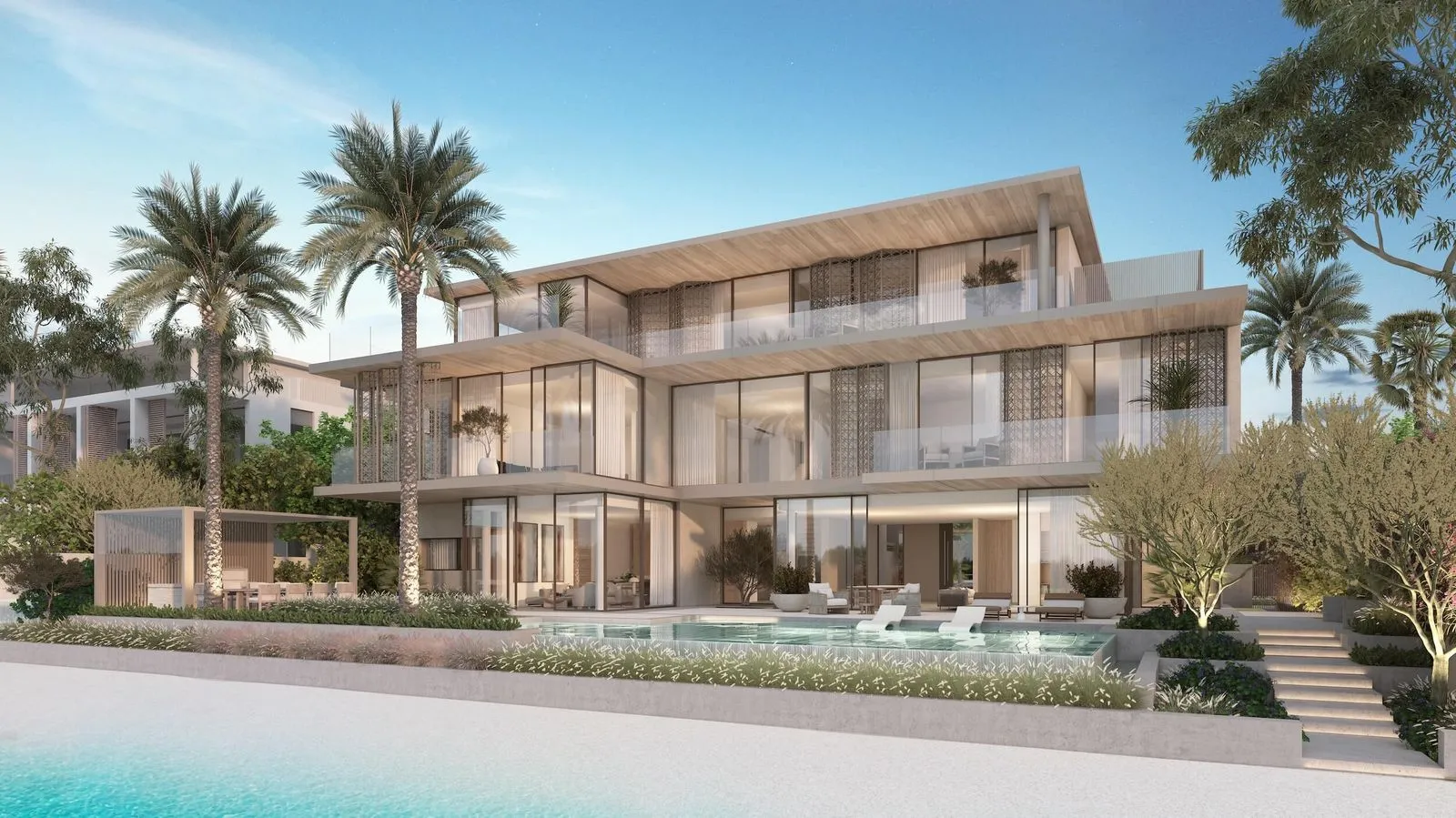 Luxury villa showcasing a private pool, palm trees, and a stunning beachfront location.