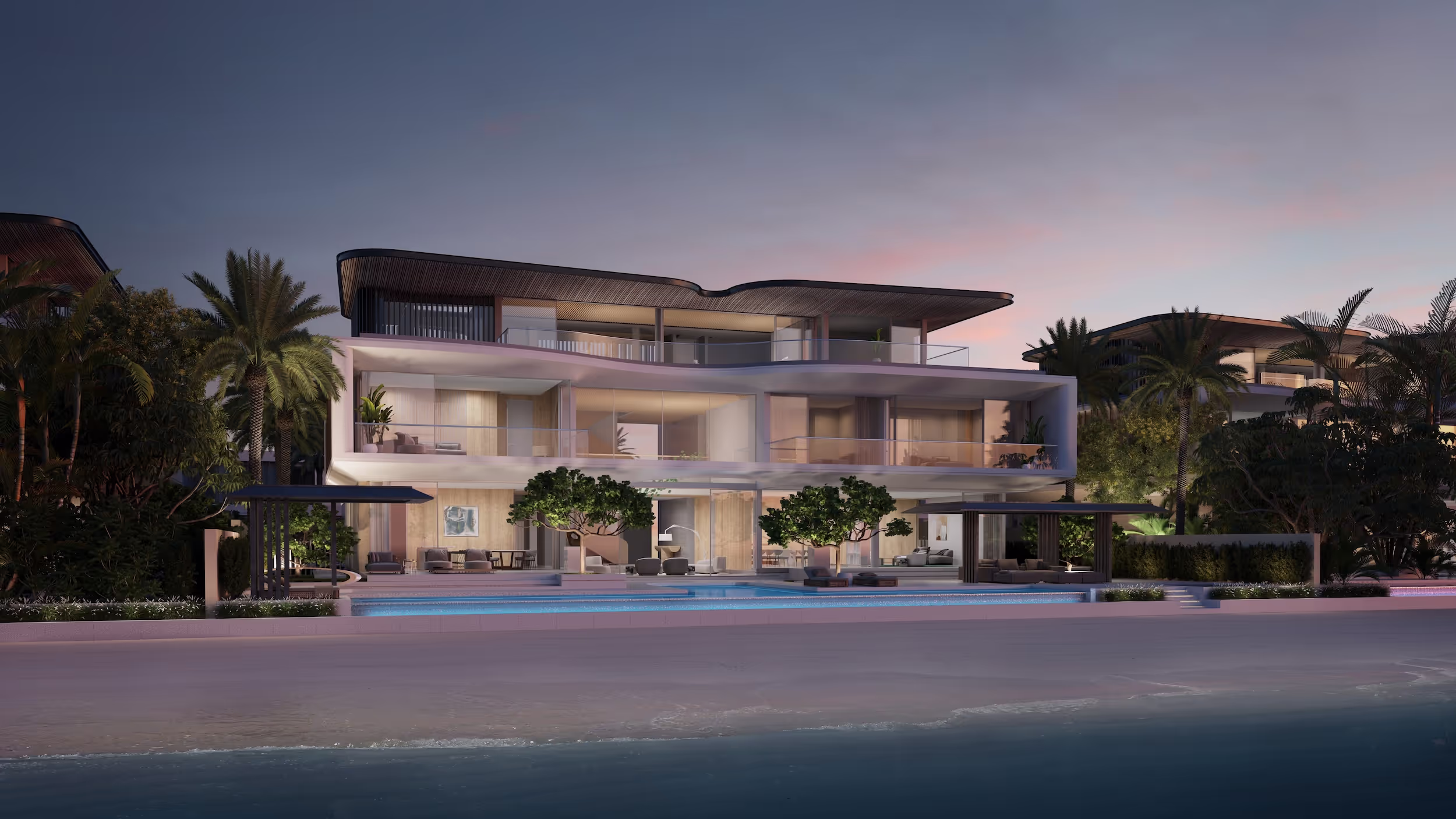 Luxury villa showcasing a private pool, palm trees, and a stunning beachfront location.