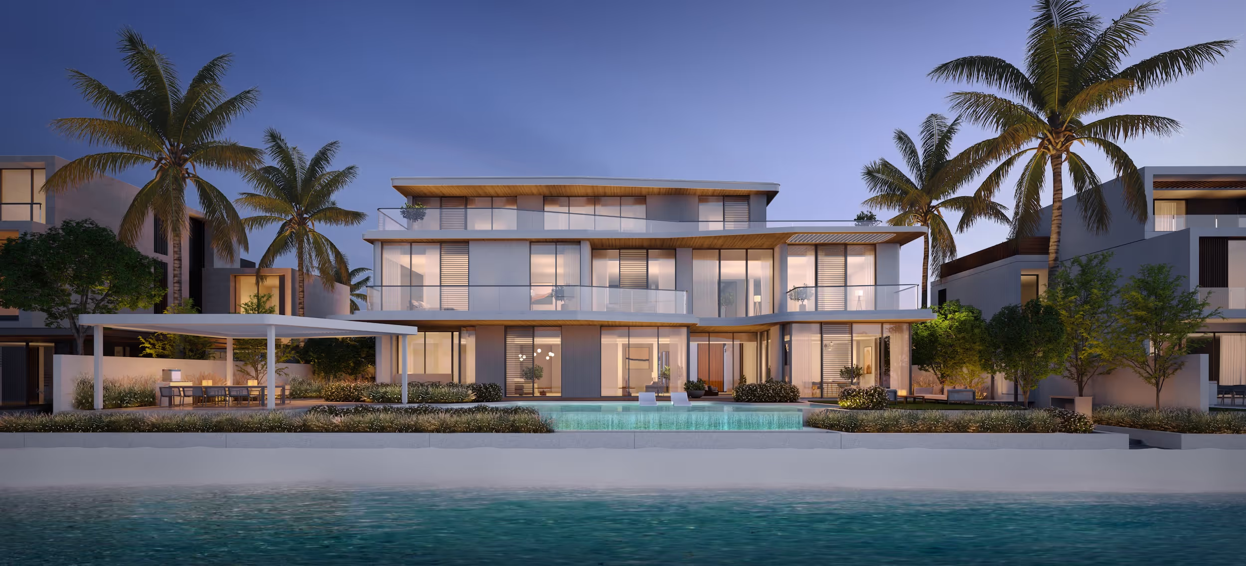 Luxury villa showcasing a private pool, palm trees, and a stunning beachfront location.