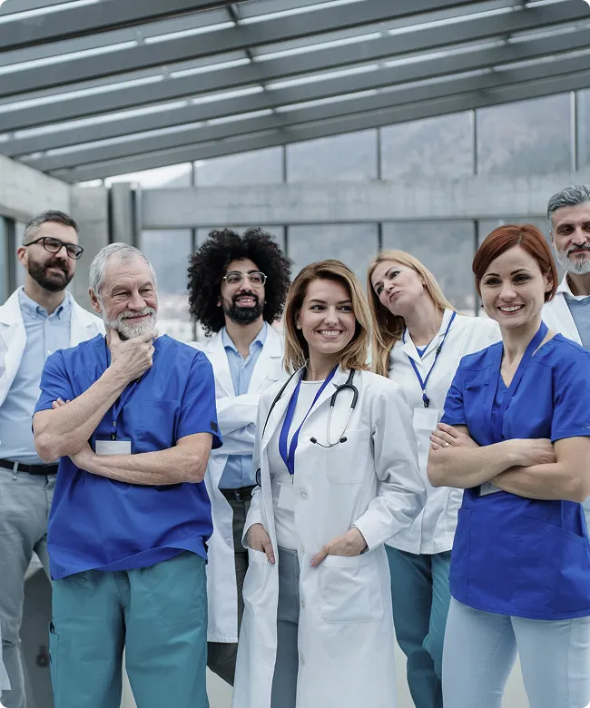 SmartCare Rx Pharmacy team of diverse healthcare professionals standing confidently together in a modern medical facility, symbolizing expert collaborative care