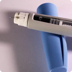 SmartCare Rx Pharmacy GLP-1 medication injection pen with a blue cap, highlighting advanced diabetes care and medication delivery