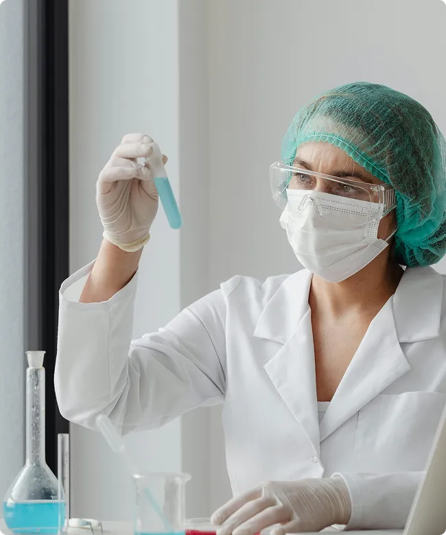 SmartCare Rx Pharmacy female doctor holding a hormone therapy box, highlighting specialized women’s health and hormone therapy care.