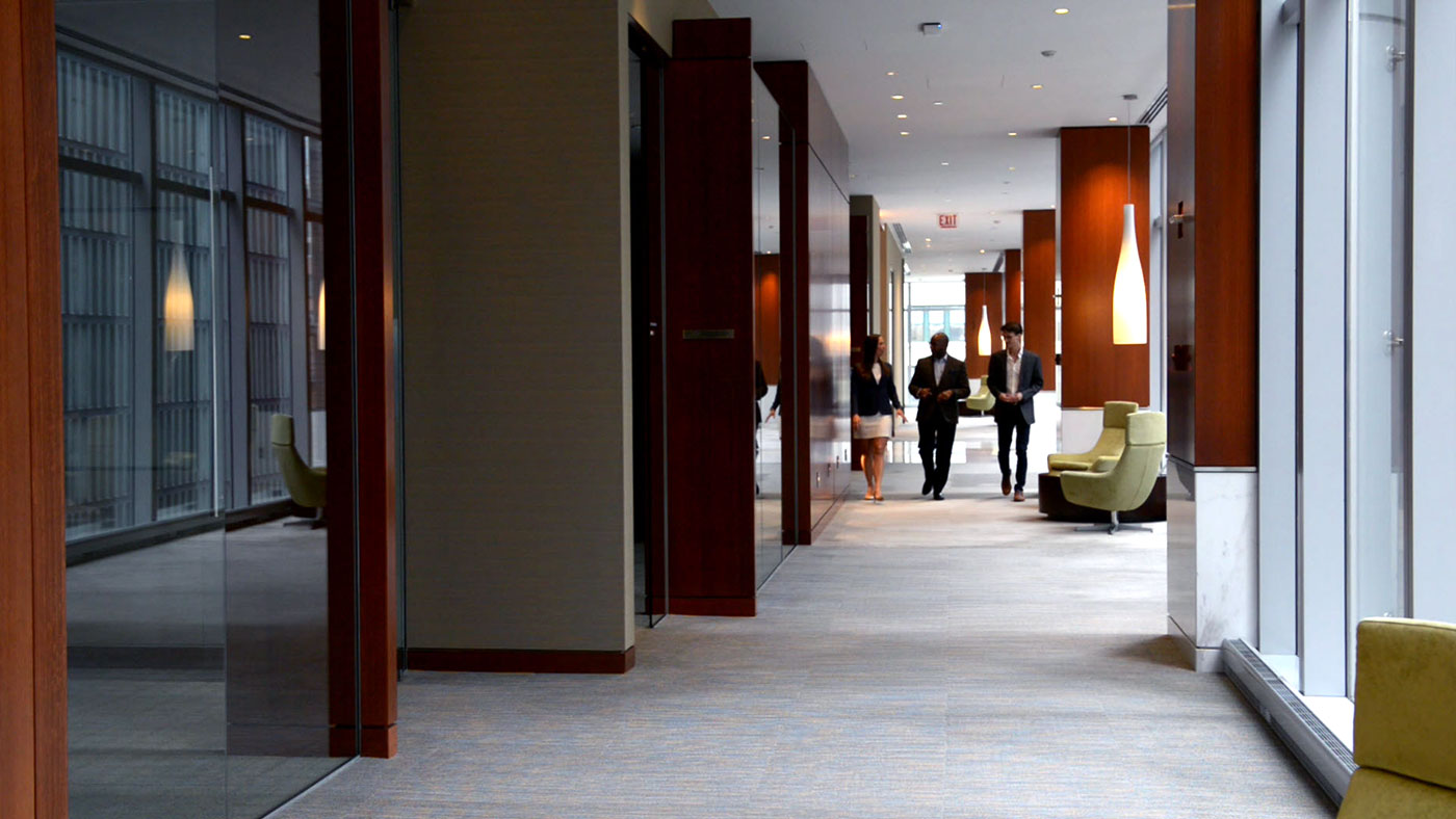 Wealth advisors walking down a hallway
