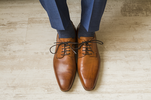 brown shoes with blue pants