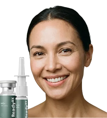 Smiling woman holding nasal spray bottle, displaying a bright, friendly expression against white background.