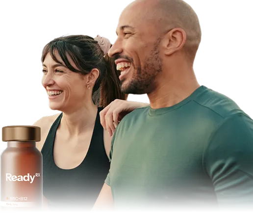 Smiling couple with ReadyRx supplement bottle, man in green shirt next to woman
