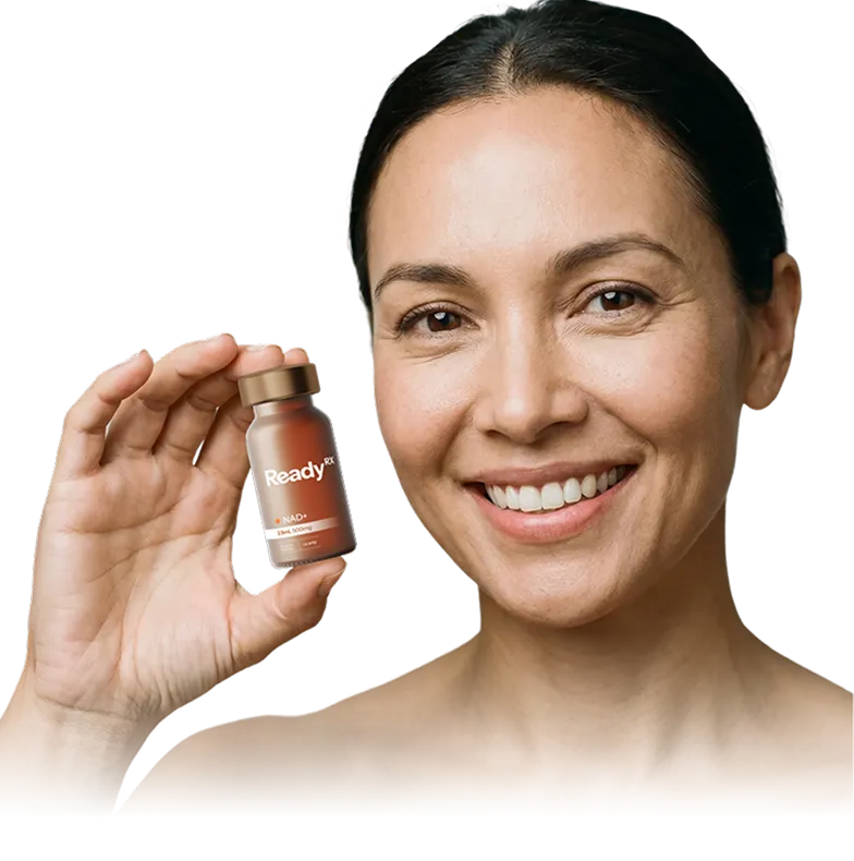Smiling woman holding small amber bottle of ReadyRx NAD+ supplement product