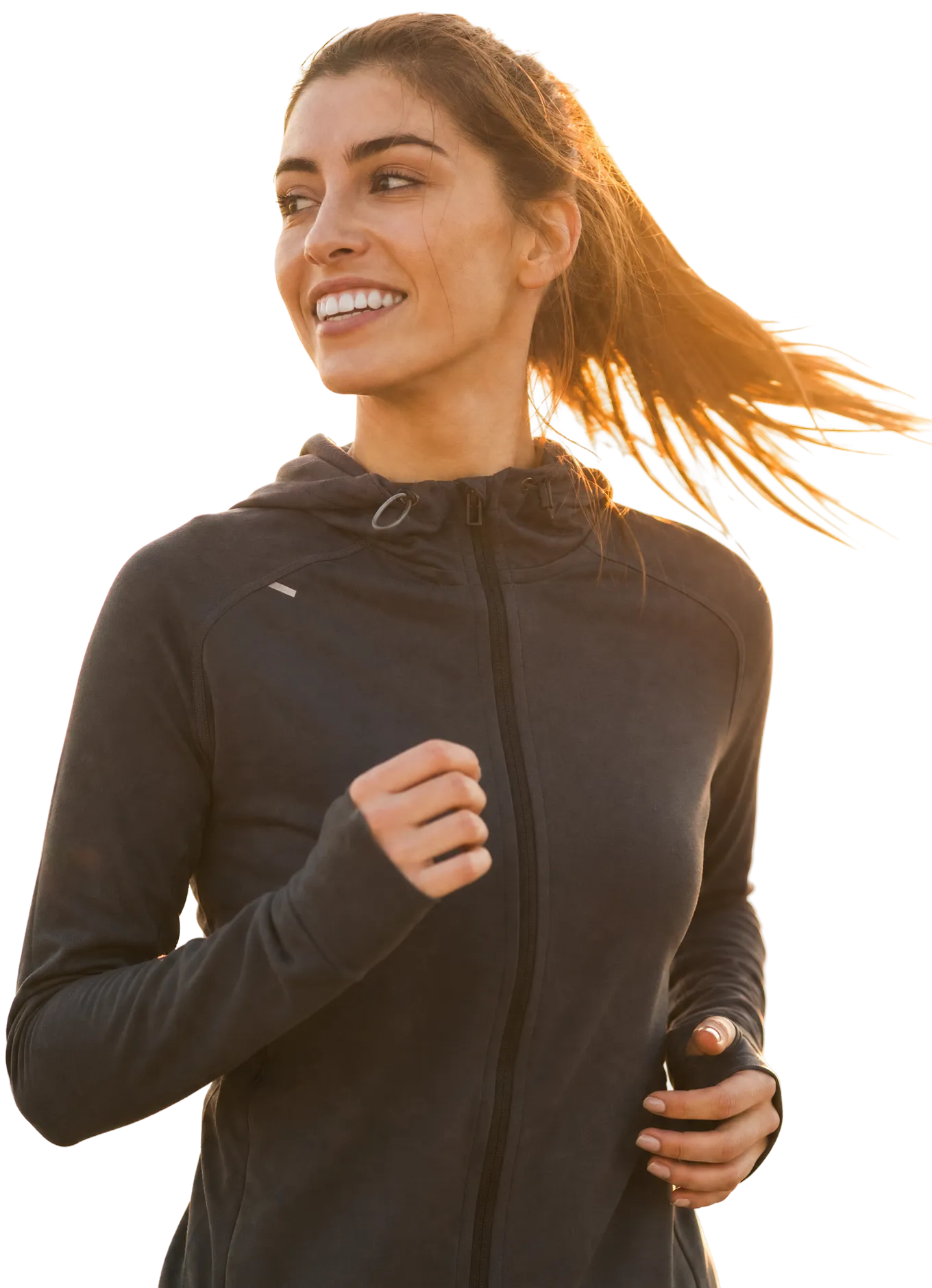 Woman jogging in black athletic jacket, smiling while running