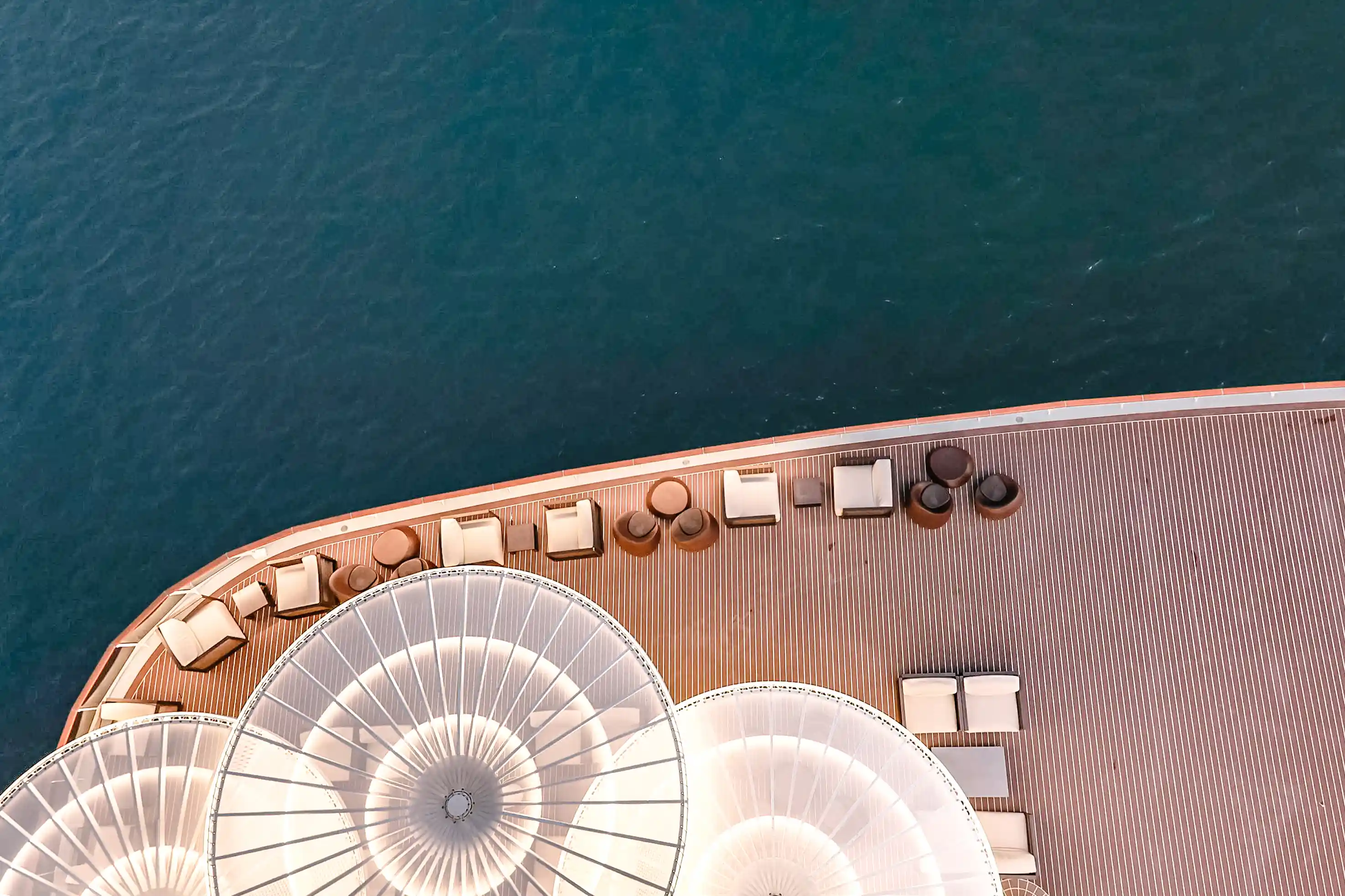 lounge chairs alongside cruise ship deck