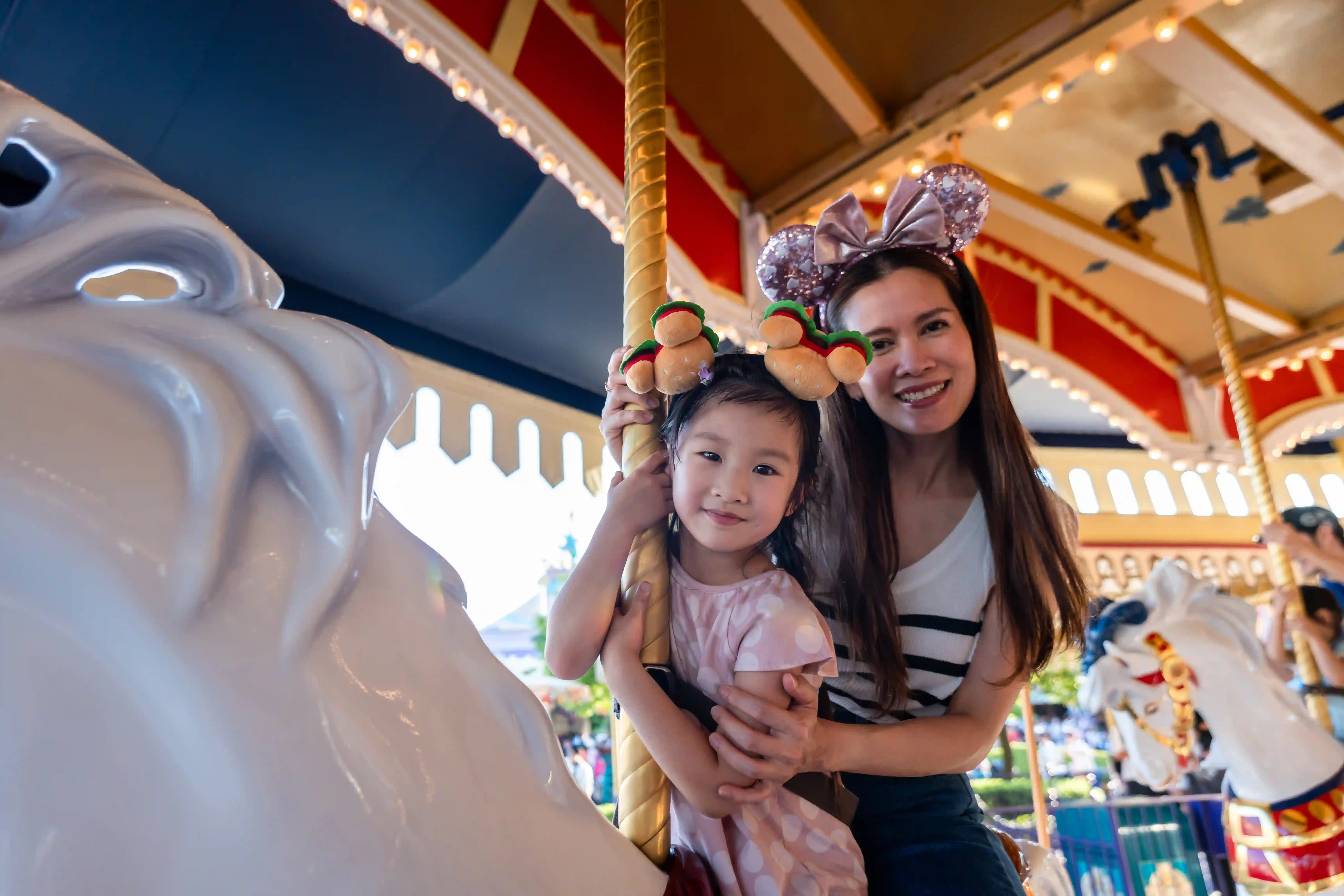 mother and child on carousel
