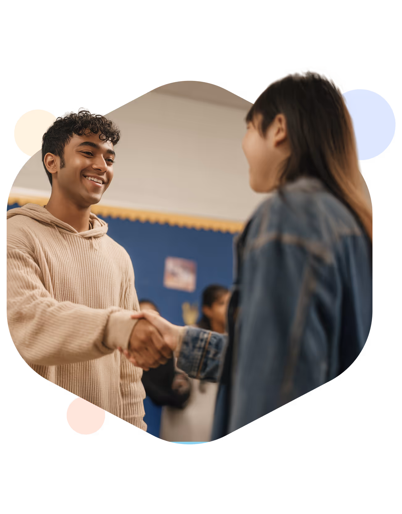 Students shaking hands during STEM Fellowship leadership program promoting collaboration and best practices