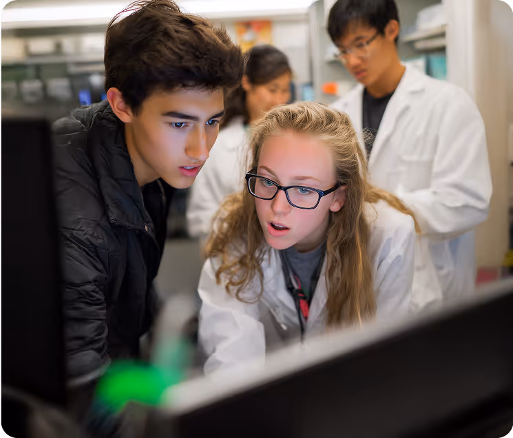 Students collaborating on computer-based STEM research and science project
