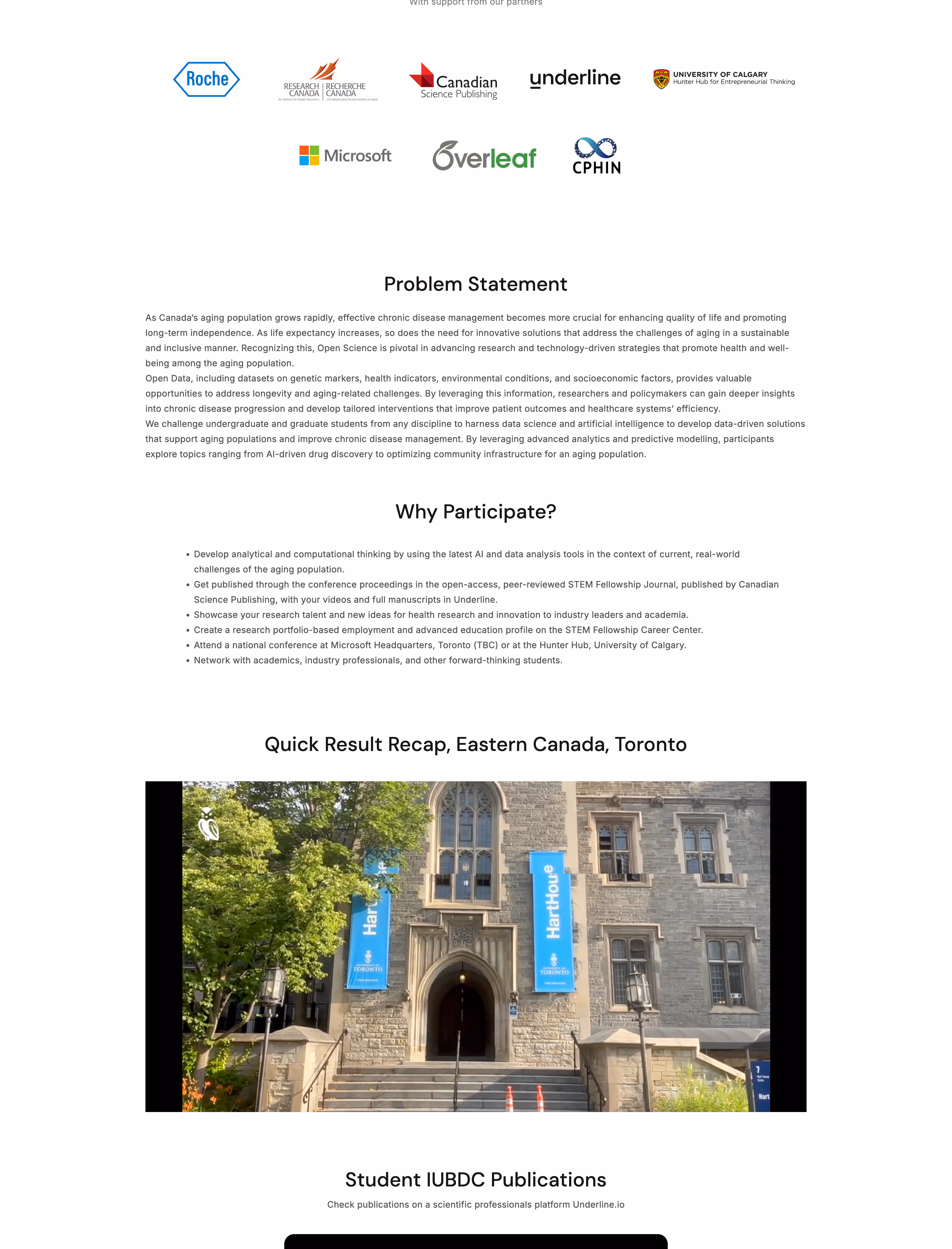 Stone building entrance with two blue banners reading 'Hart House' and 'University of Toronto' flanked by trees and stairs leading up.