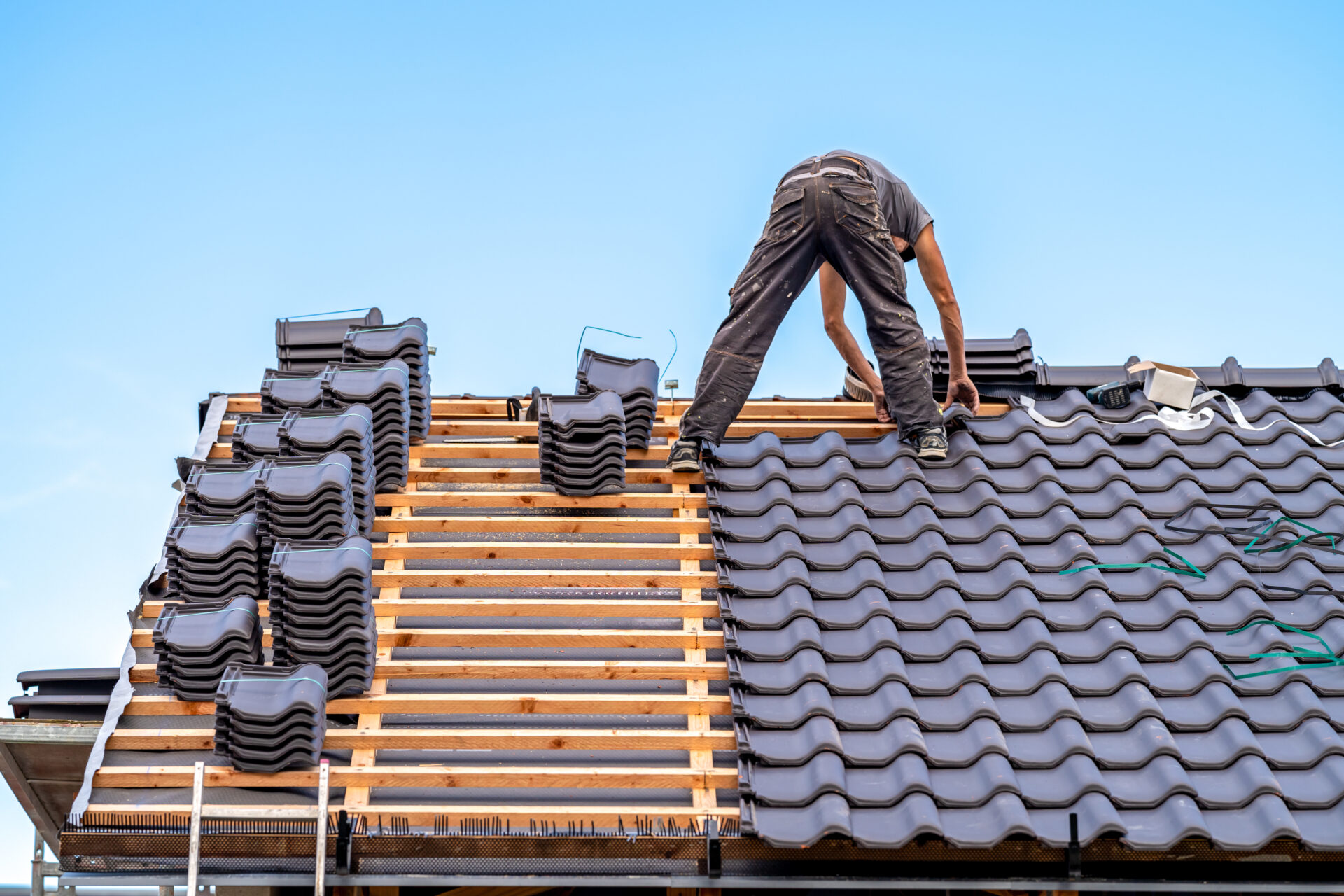 KAISE Residential Roofing Construction picture with roof materials and shingles.
