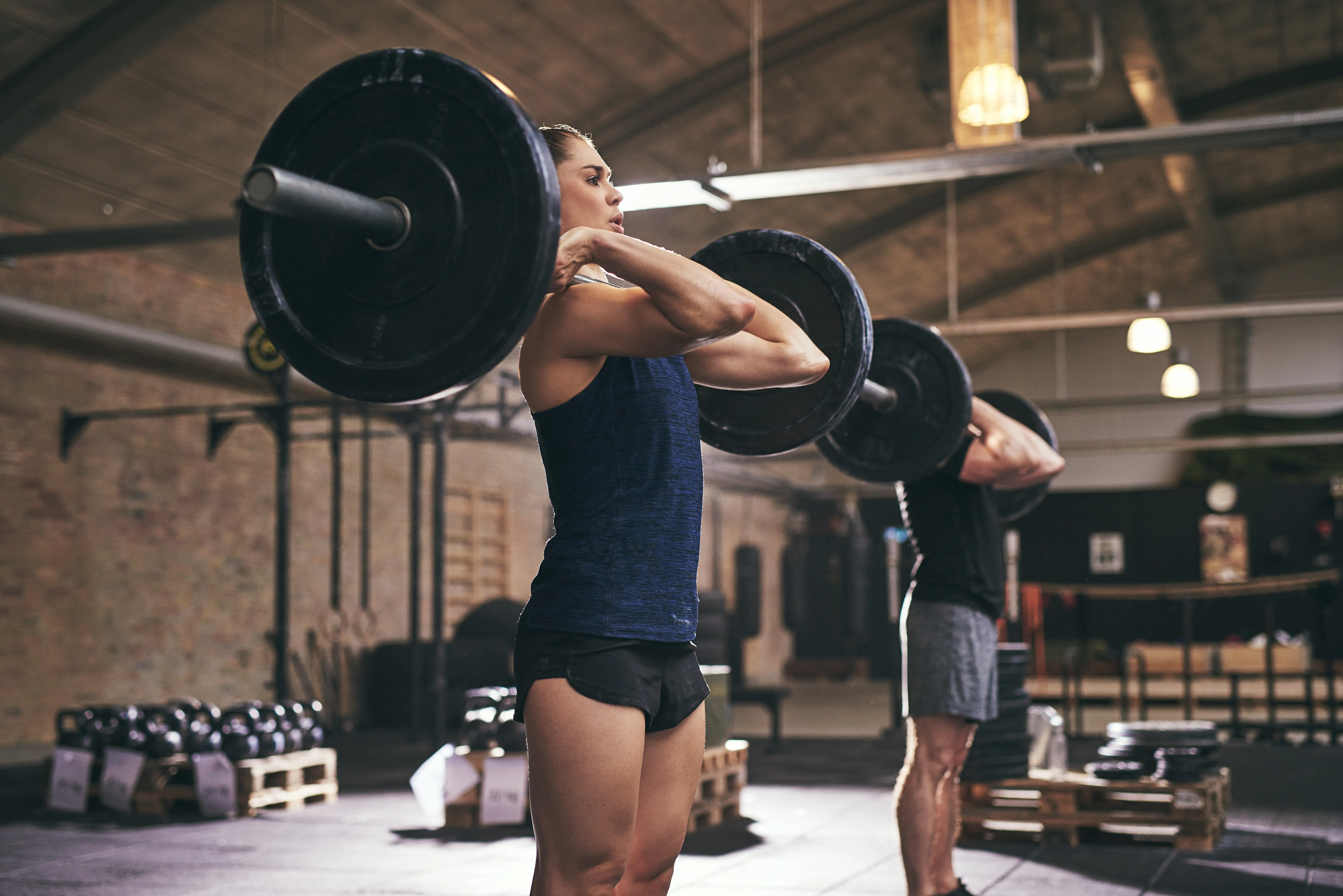 Male and Female performing a front rack getting ready to front squat