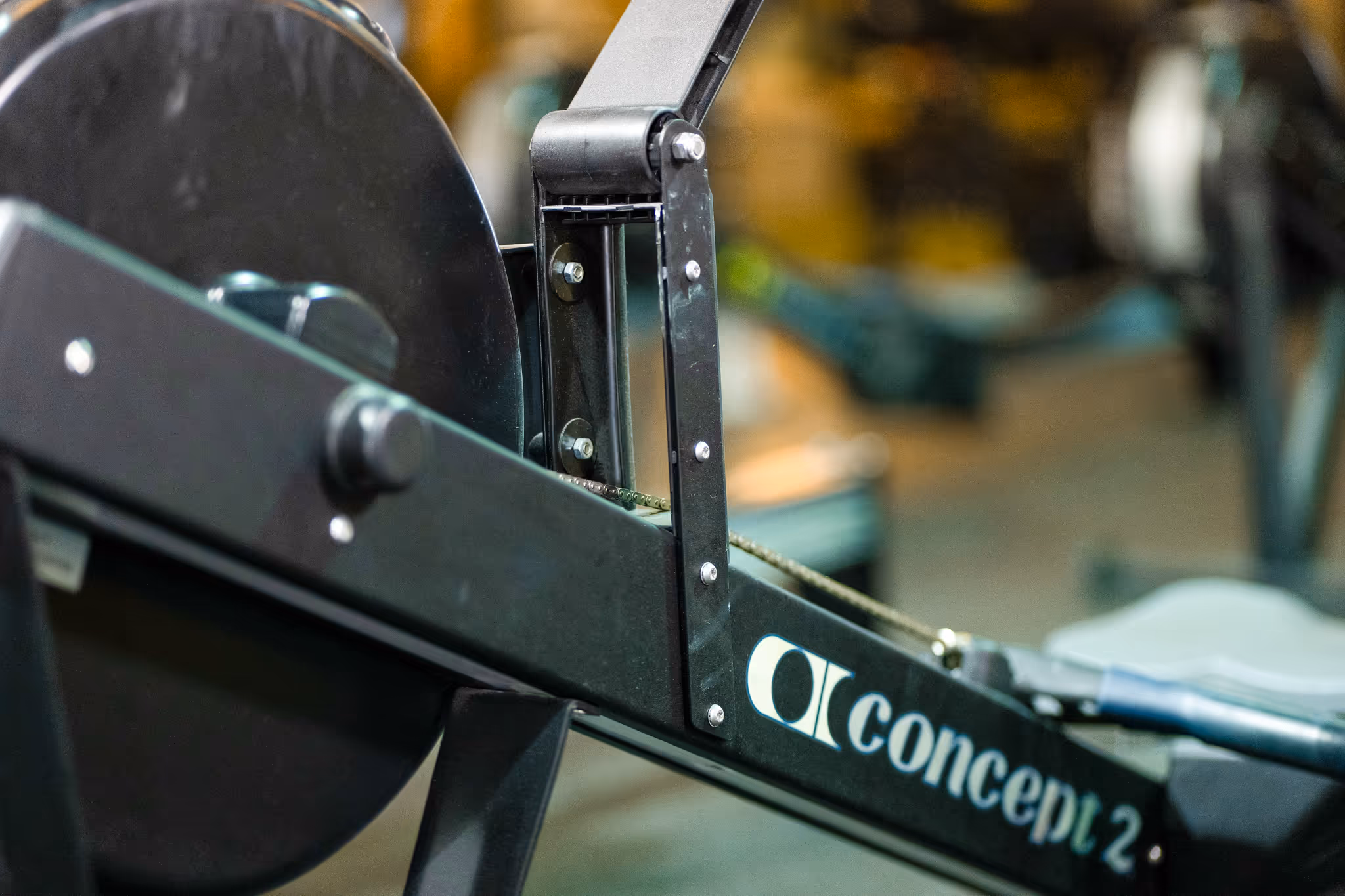 Close-up of a Concept2 rowing machine with focus on the flywheel and brand logo.