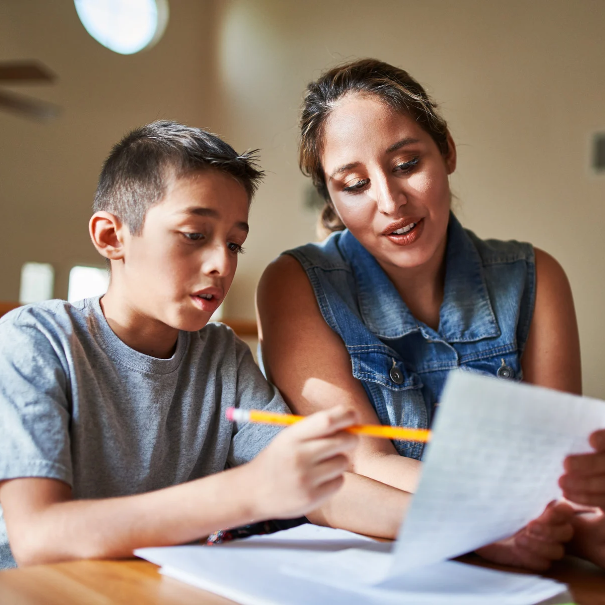 Mom helping son with homework