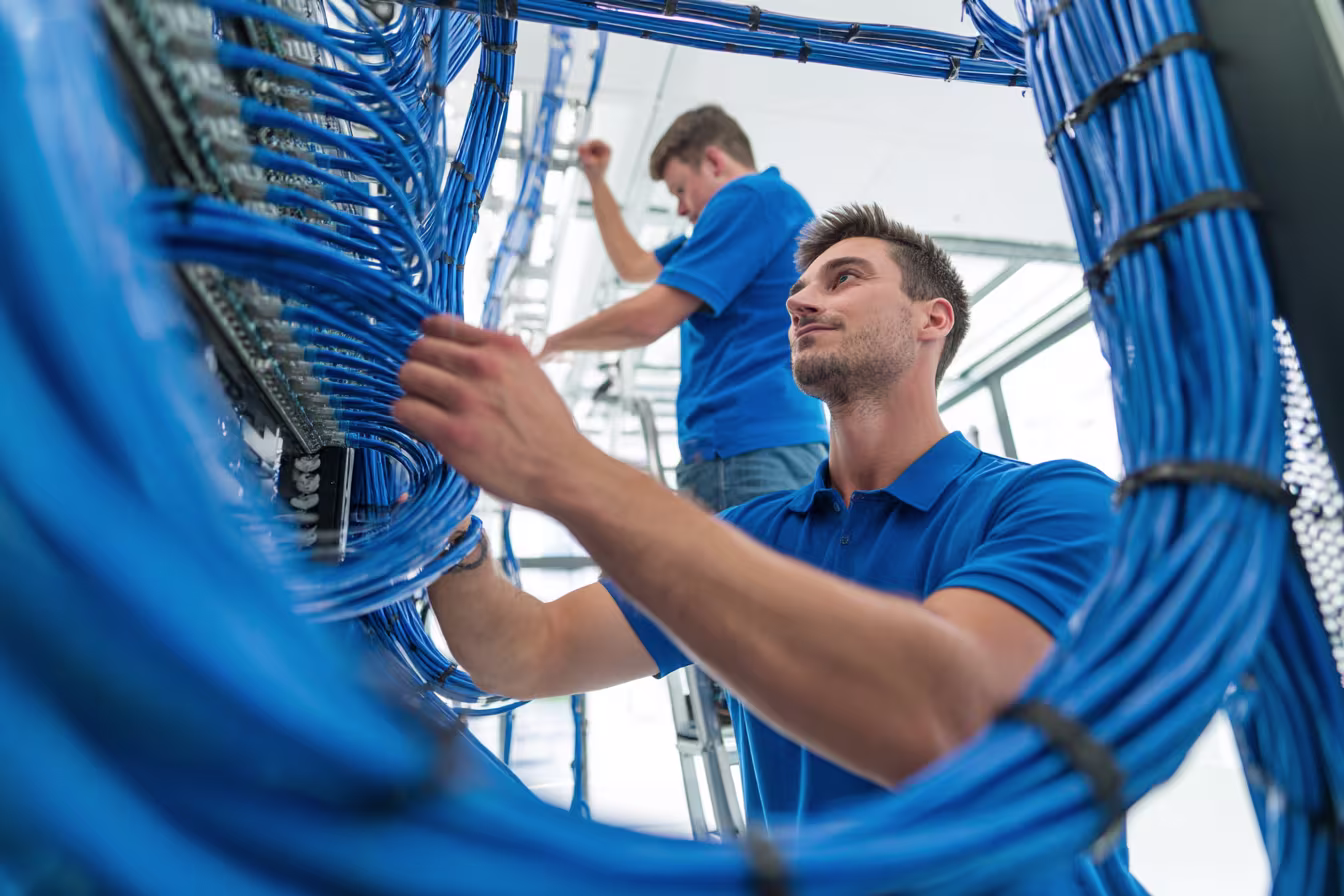 MSP team inspecting business network cabling