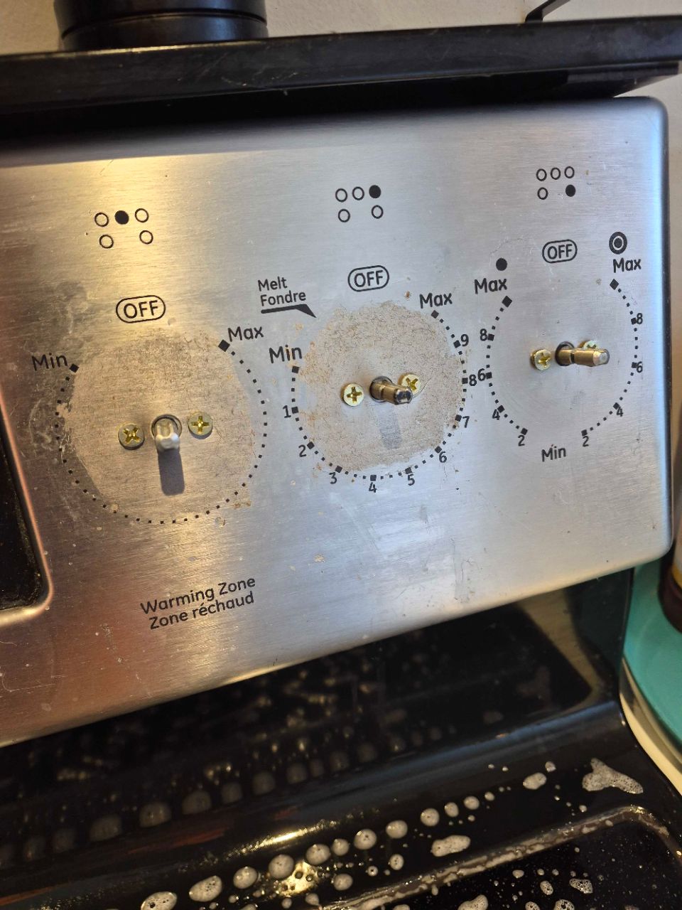 Before photo of detailed stove cleaning