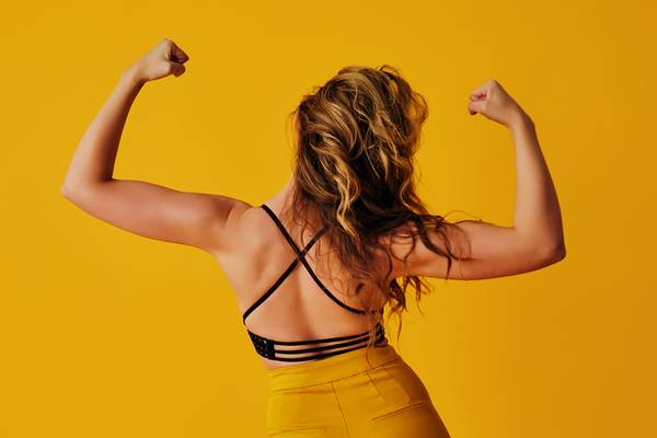 Reduce calorie intake to get rid of back fat.